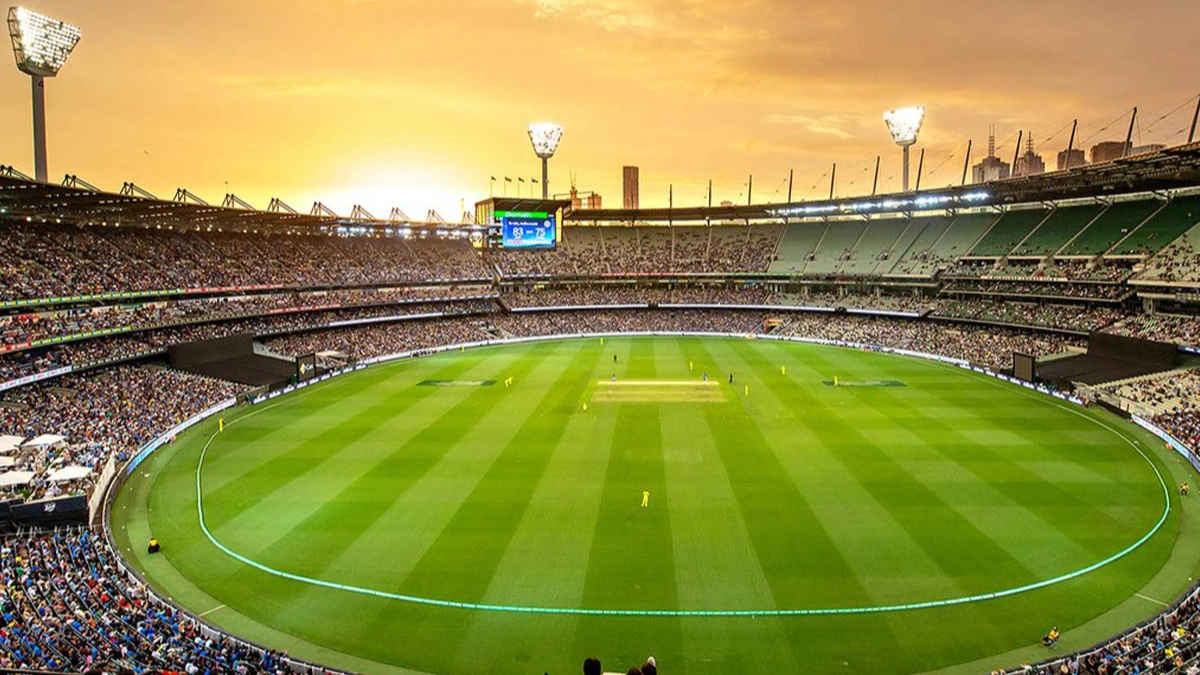 Blurred stadium crowd or wide shot of a ground
